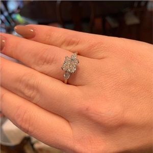 Three stone 14k rose gold moissanite ring